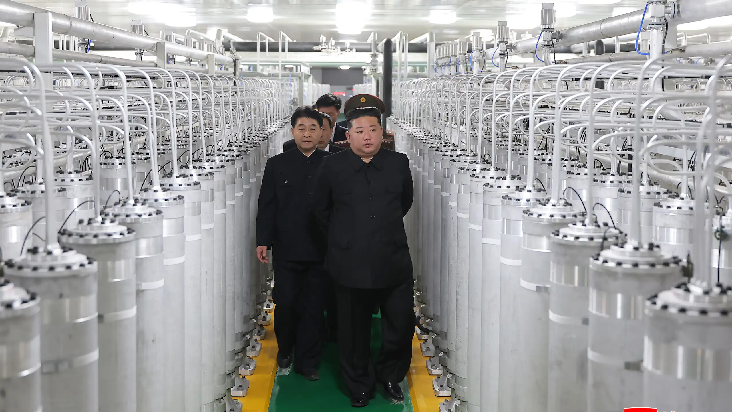 North Korean leader Kim Jong Un (C-R) as he inspects a nuclear materials production factory at an undisclosed location in North Korea