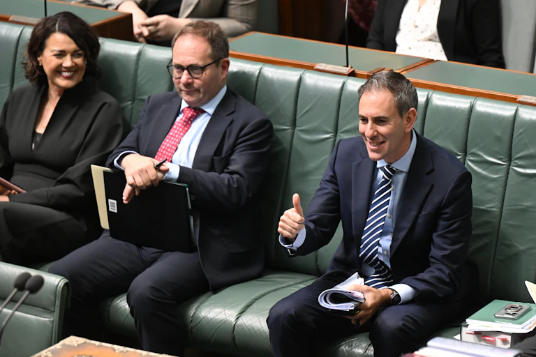 Treasurer Jim Chalmers gives a thumbs-up as he sits in the House of Representatives