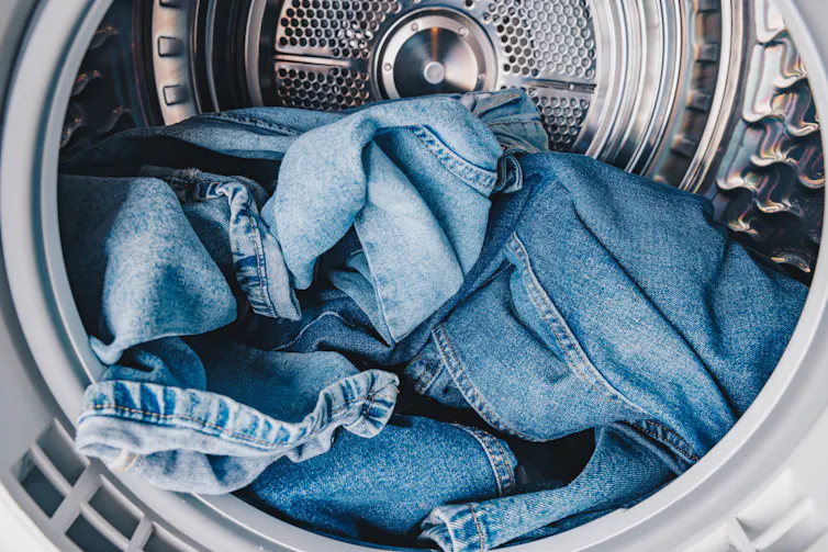 denim blue jeans in washing machine