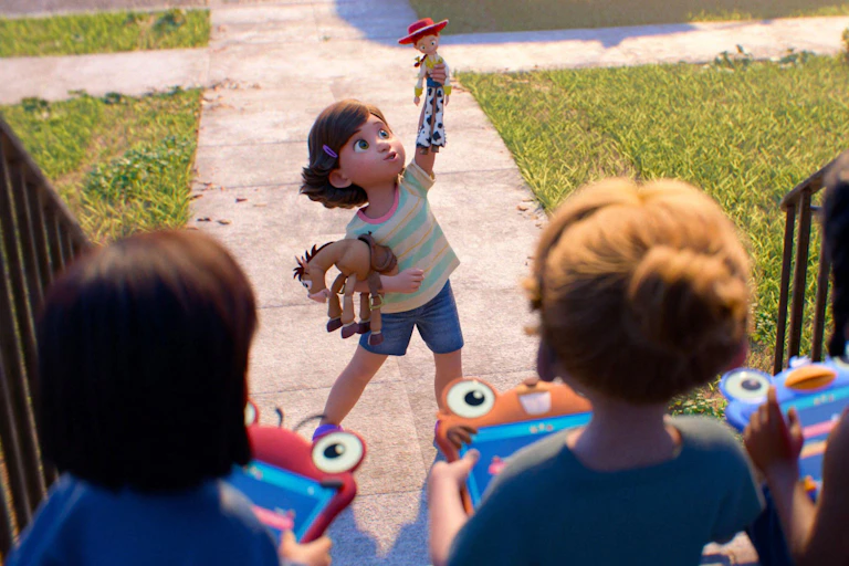 Bonnie holds her Jessie doll aloft.