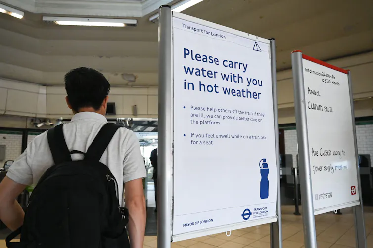Hot weather warning sign on London underground