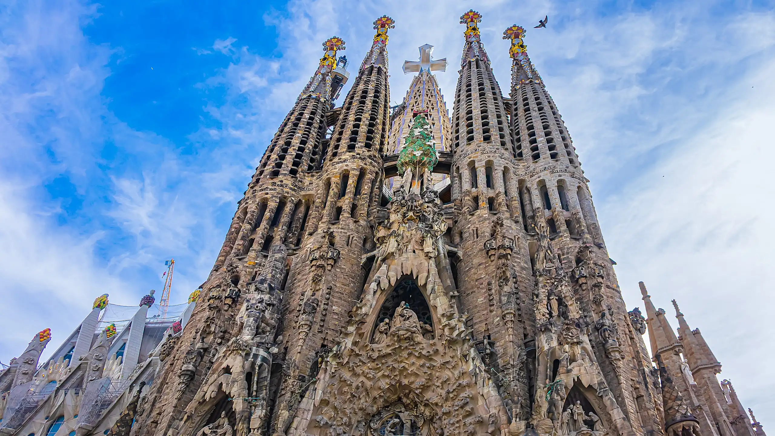 The Sagrada Família showing its tower dedicated to Jesus Christ, featuring a huge three-dimensional four-pointed cross.