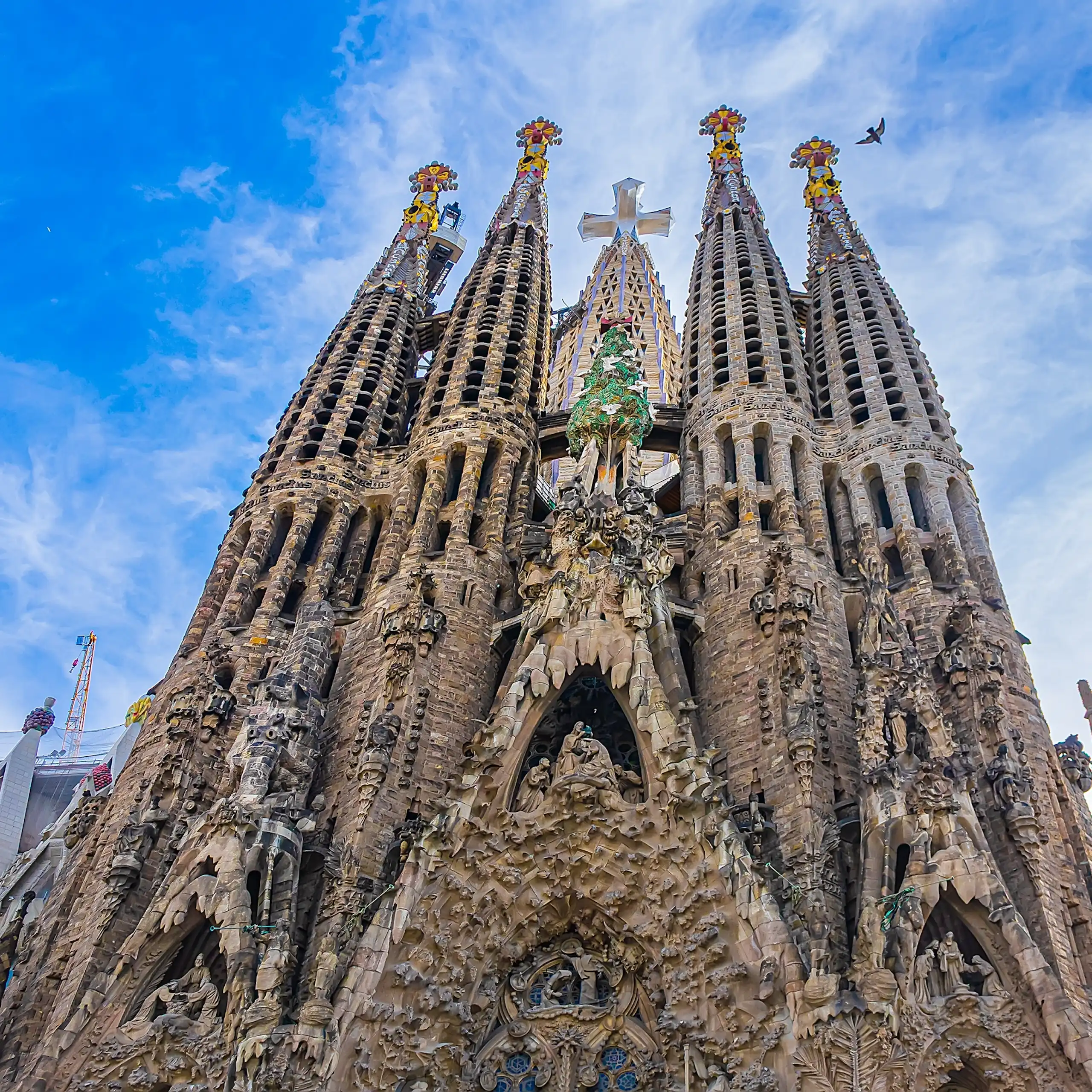 The Sagrada Família showing its tower dedicated to Jesus Christ, featuring a huge three-dimensional four-pointed cross.