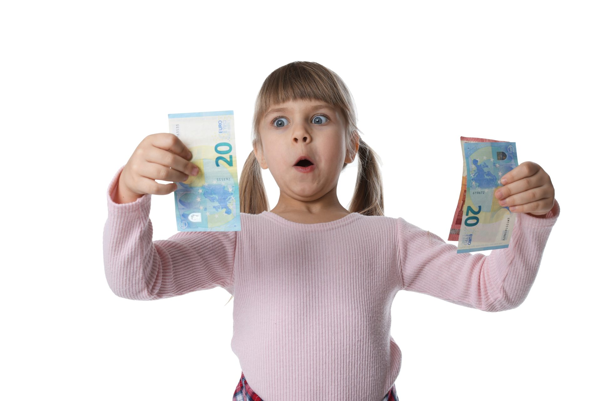 Child holding money looking surprised.