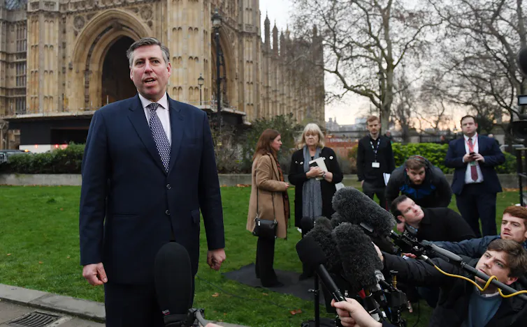 graham brady outside the houses of parliament speaking to gathered media.