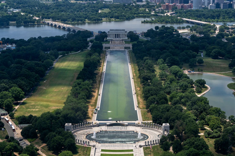 A viw of the Lincoln Memorial Reflecting Pool from above, with green algae bloom down the middle of the pool.