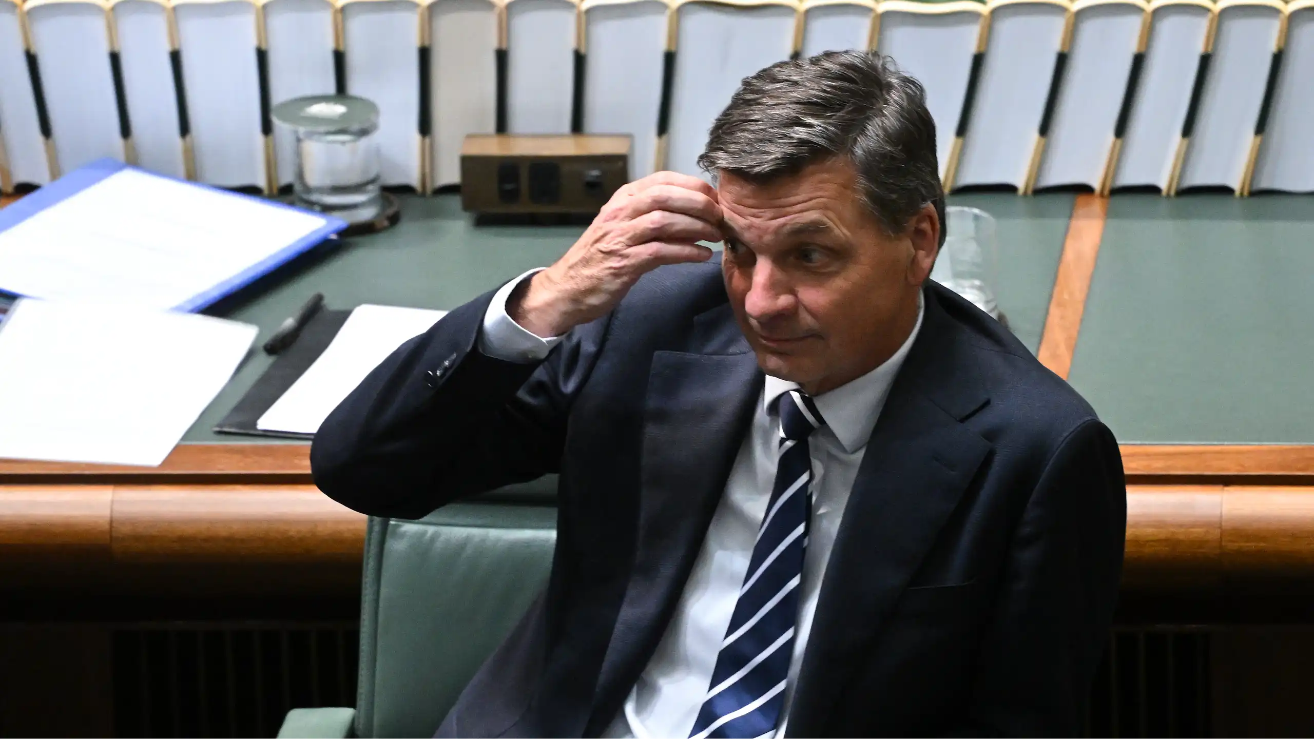 Angus Taylor scratching his forehead in parliament