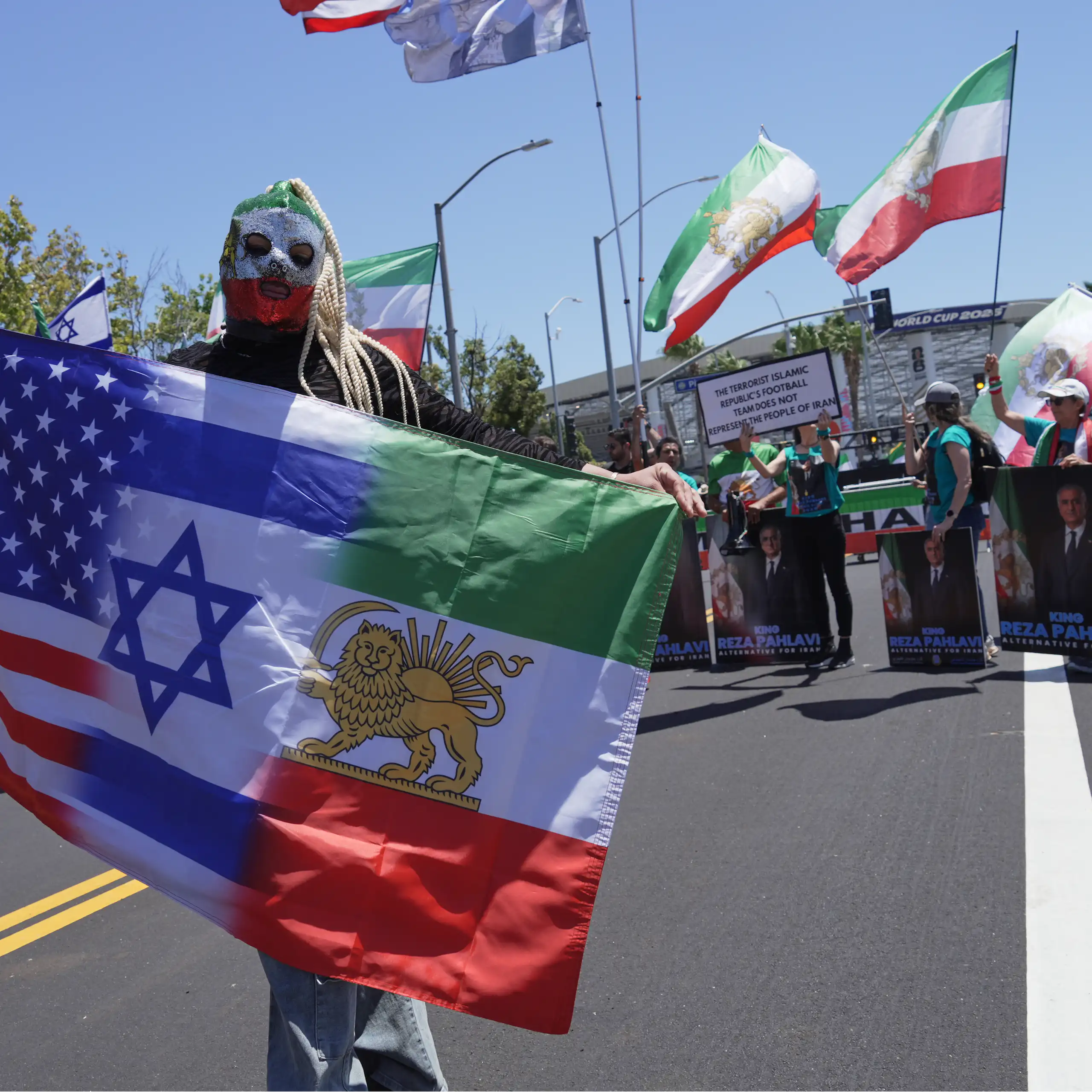 Protesters in Los Angeles gather ahead of an Iran vs. New Zealand World Cup game.