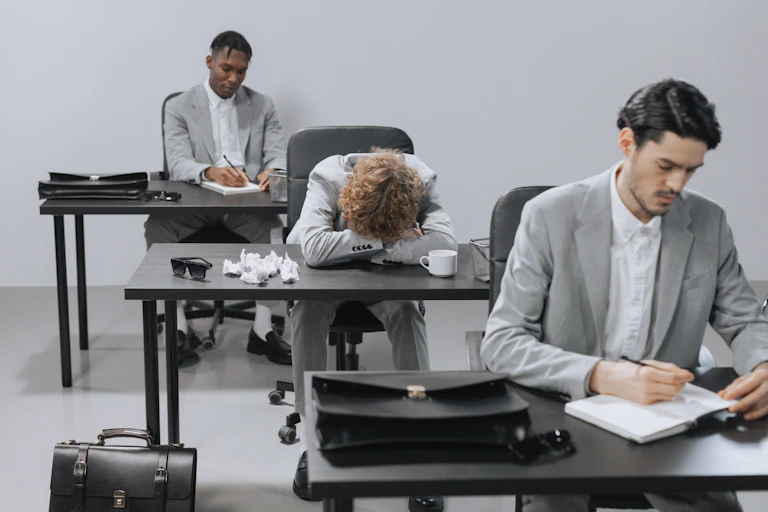 Tired employees in a modern office setting