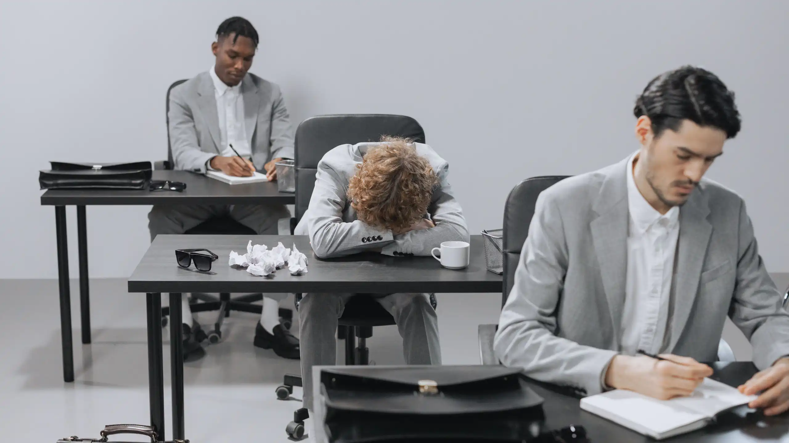 Tired employees in a modern office setting