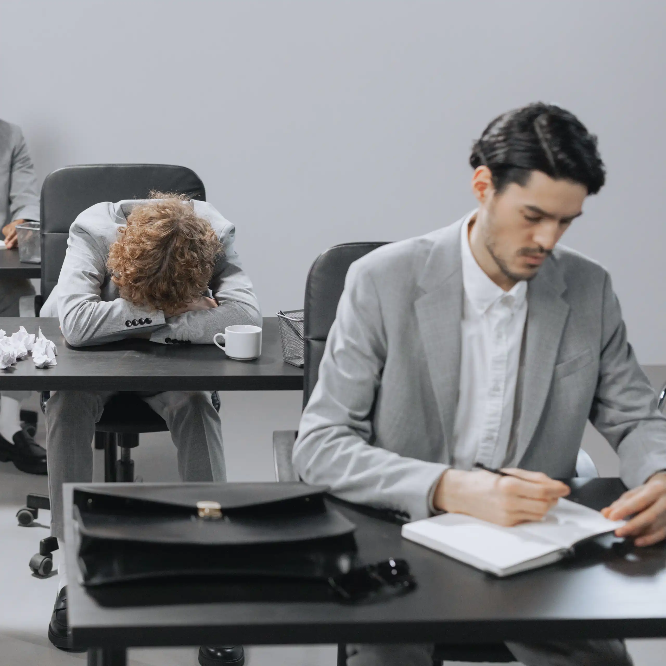Tired employees in a modern office setting