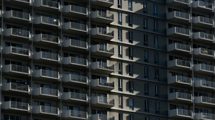 A tall apartment block.