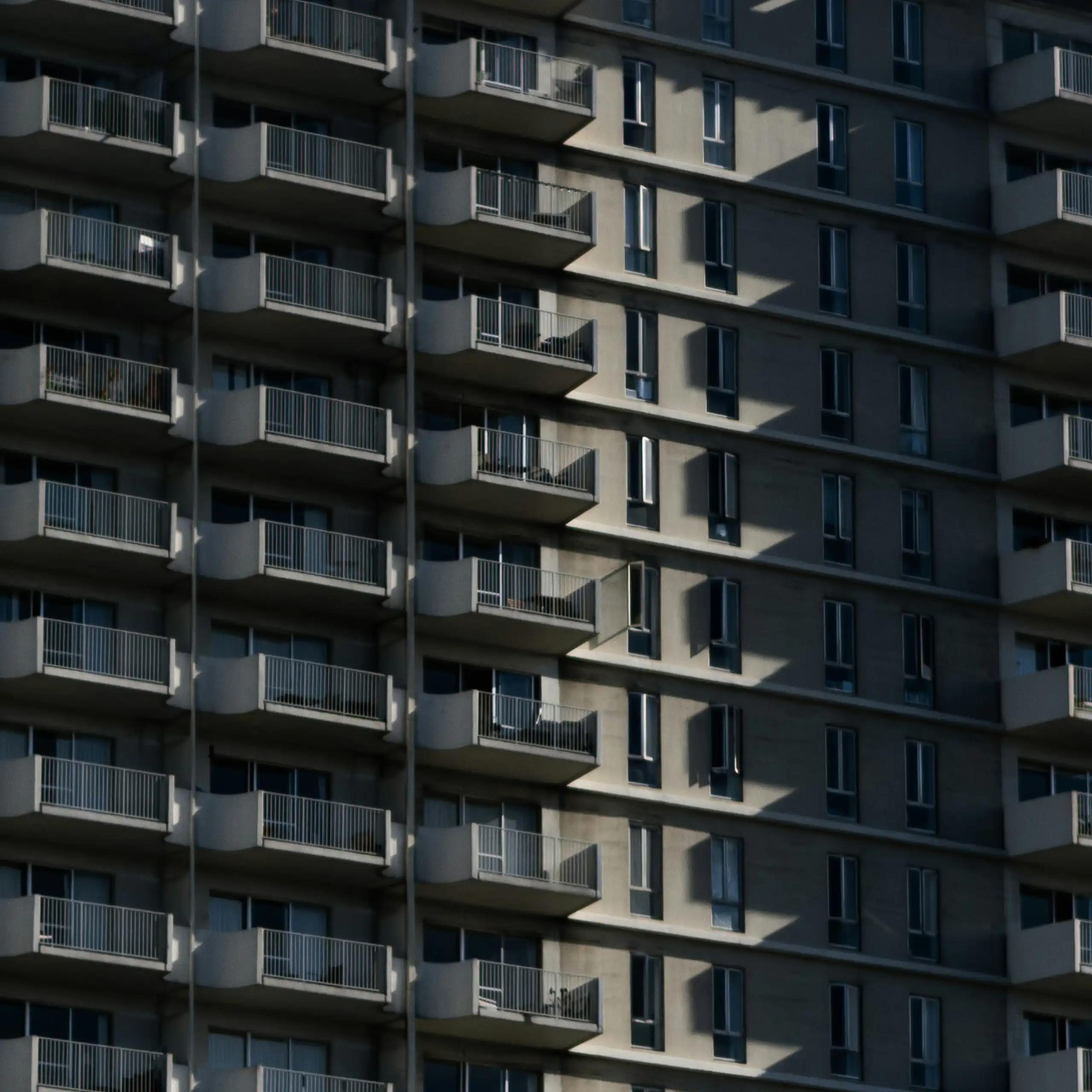 A tall apartment block.