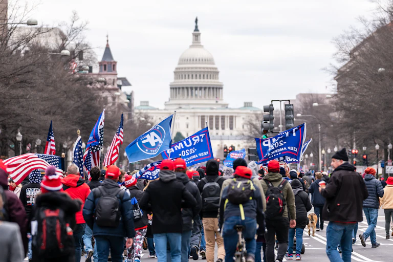 A group of Trump supporters march towards Capitol Hill on a protest aiming to prevent Joe Biden from becoming president and overturn the 2020 election result.