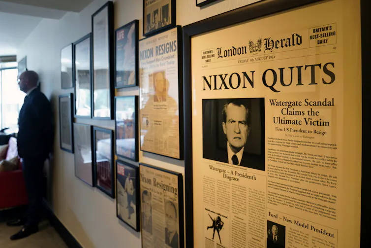 A story on the front page of a newspaper reporting Nixon's resignation following the Watergate scandal.