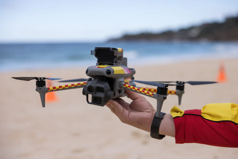 shark spotting drone, close up, beach background.