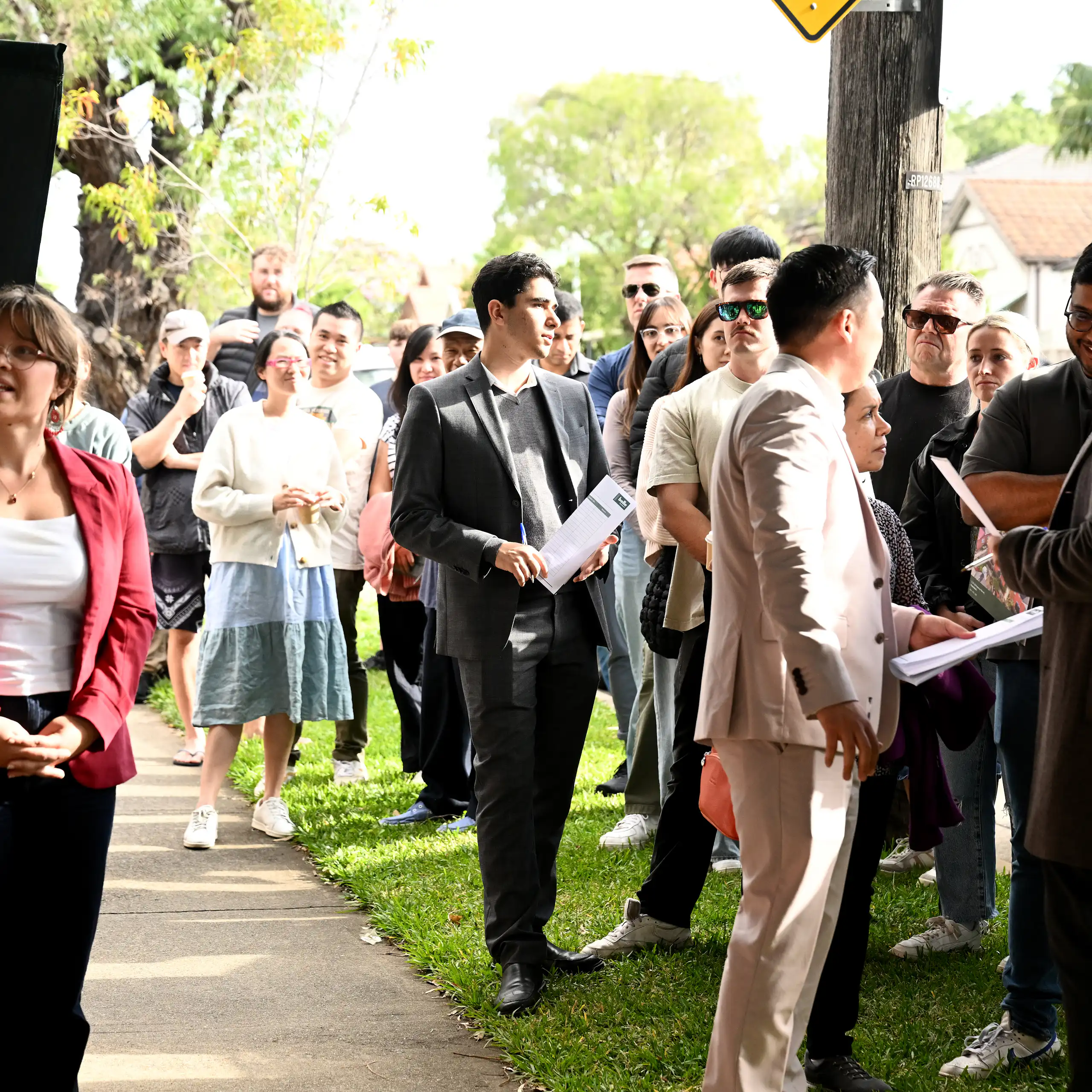 Potential home buyers attend a property auction