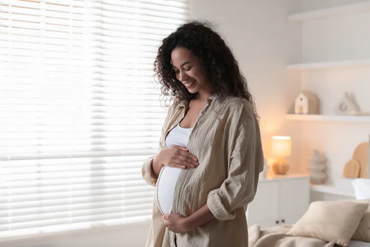 A pregnant woman.
