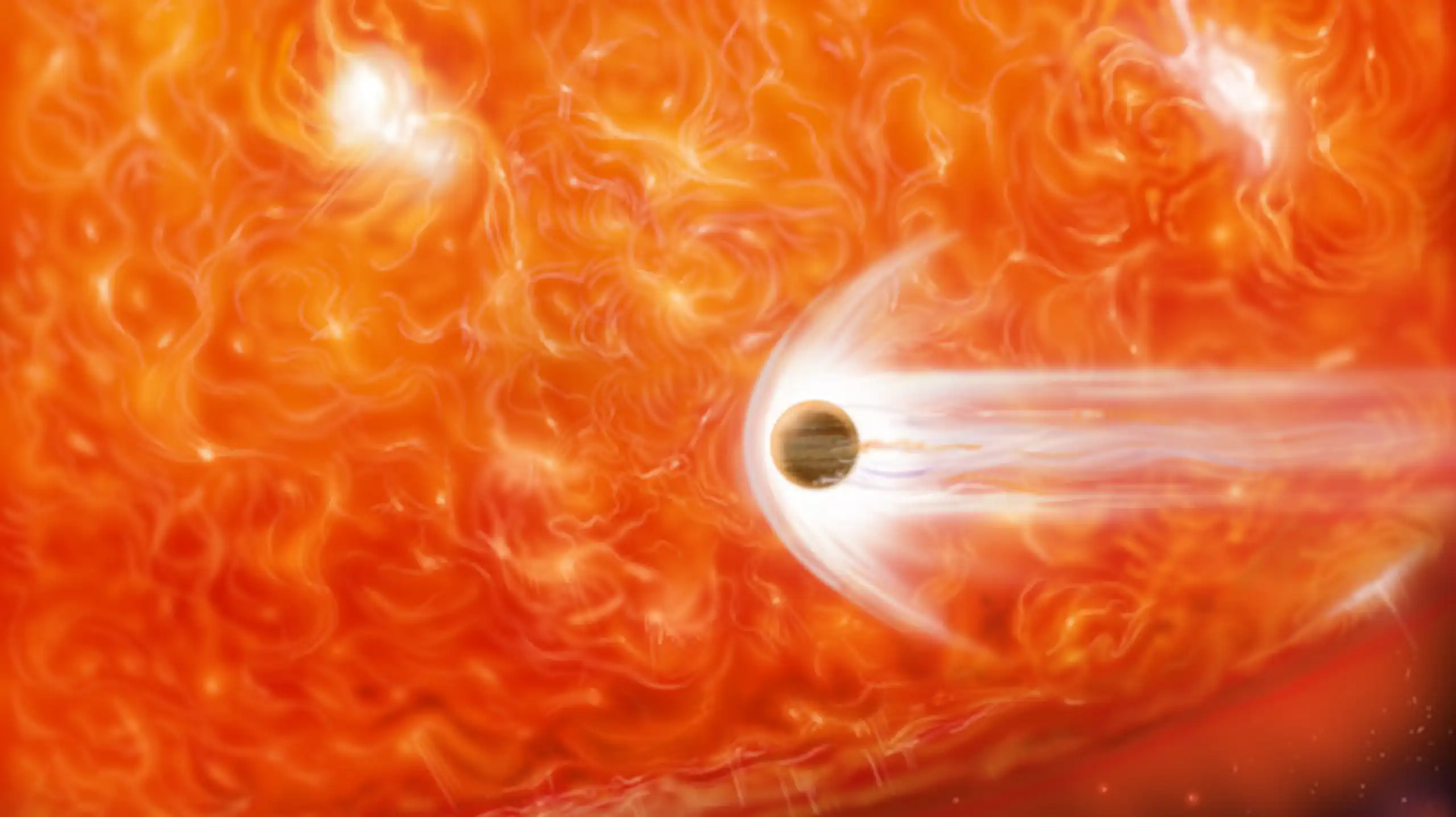 imagen de una estrella y un planeta en rojo
