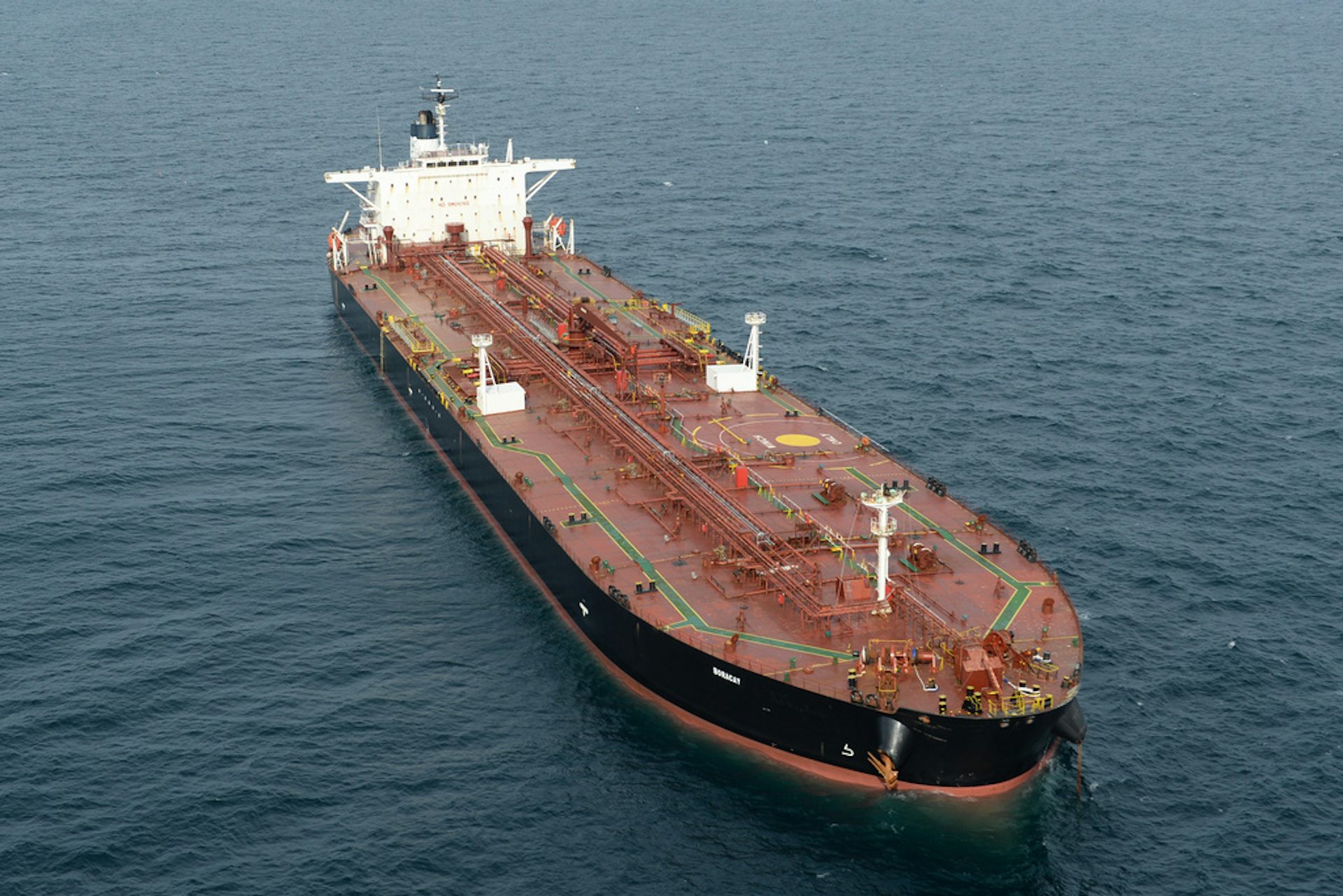 A large tanker sails in the ocean.