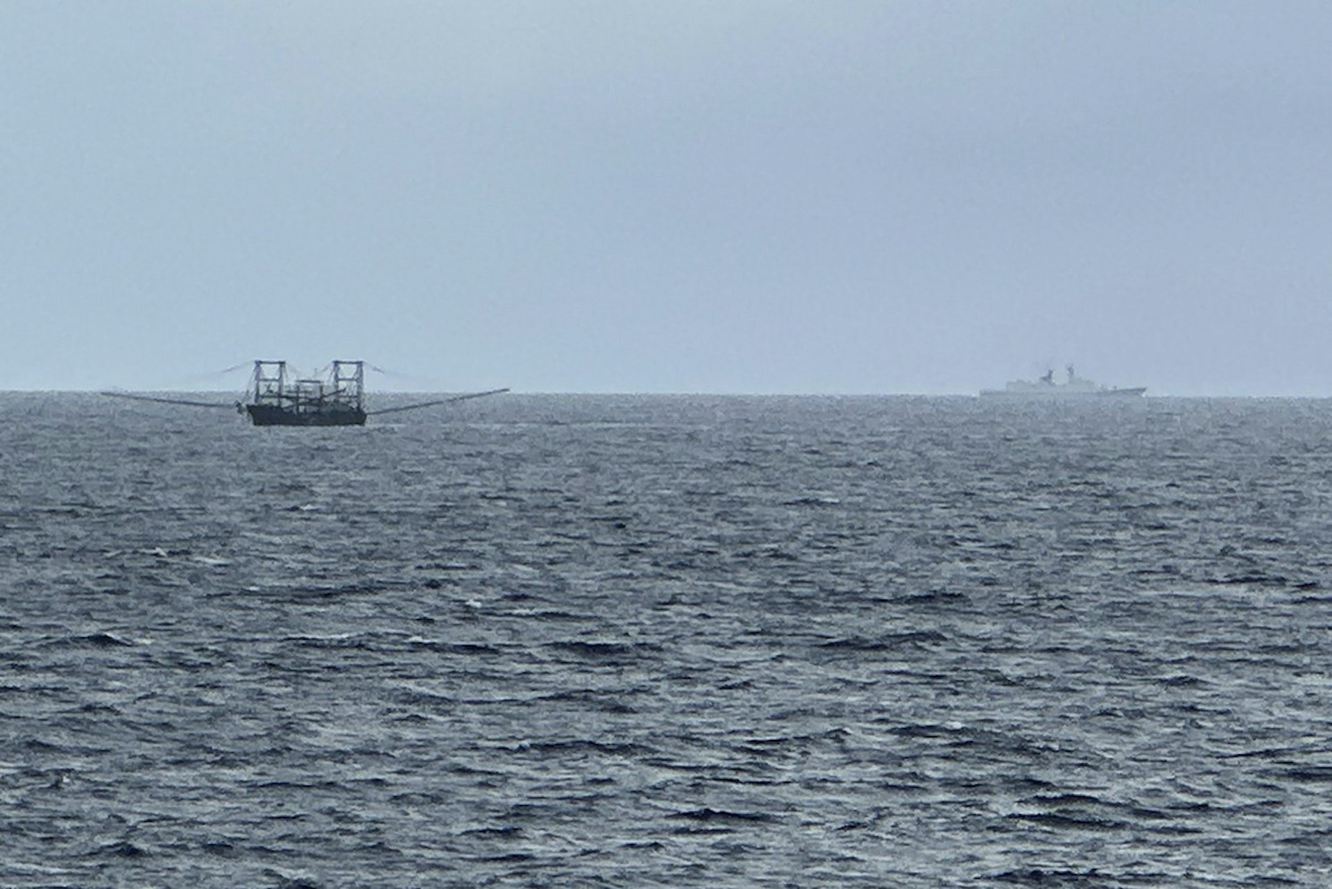 Two ships are seen on the ocean.
