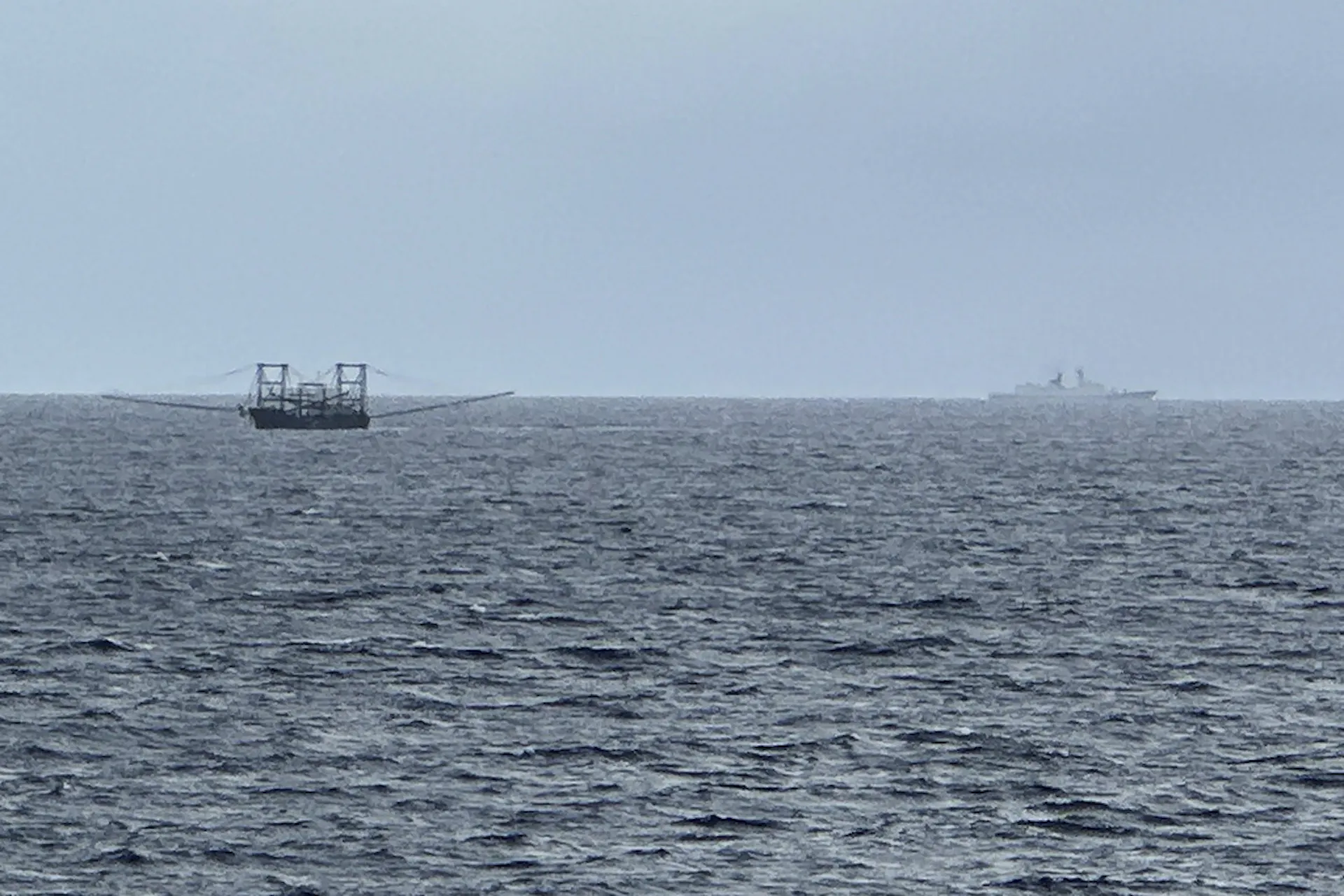 Two ships are seen on the ocean.