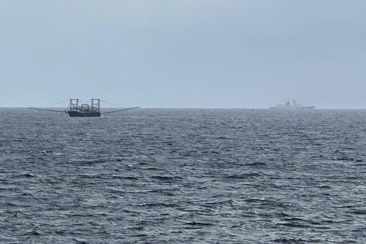 Two ships are seen on the ocean.
