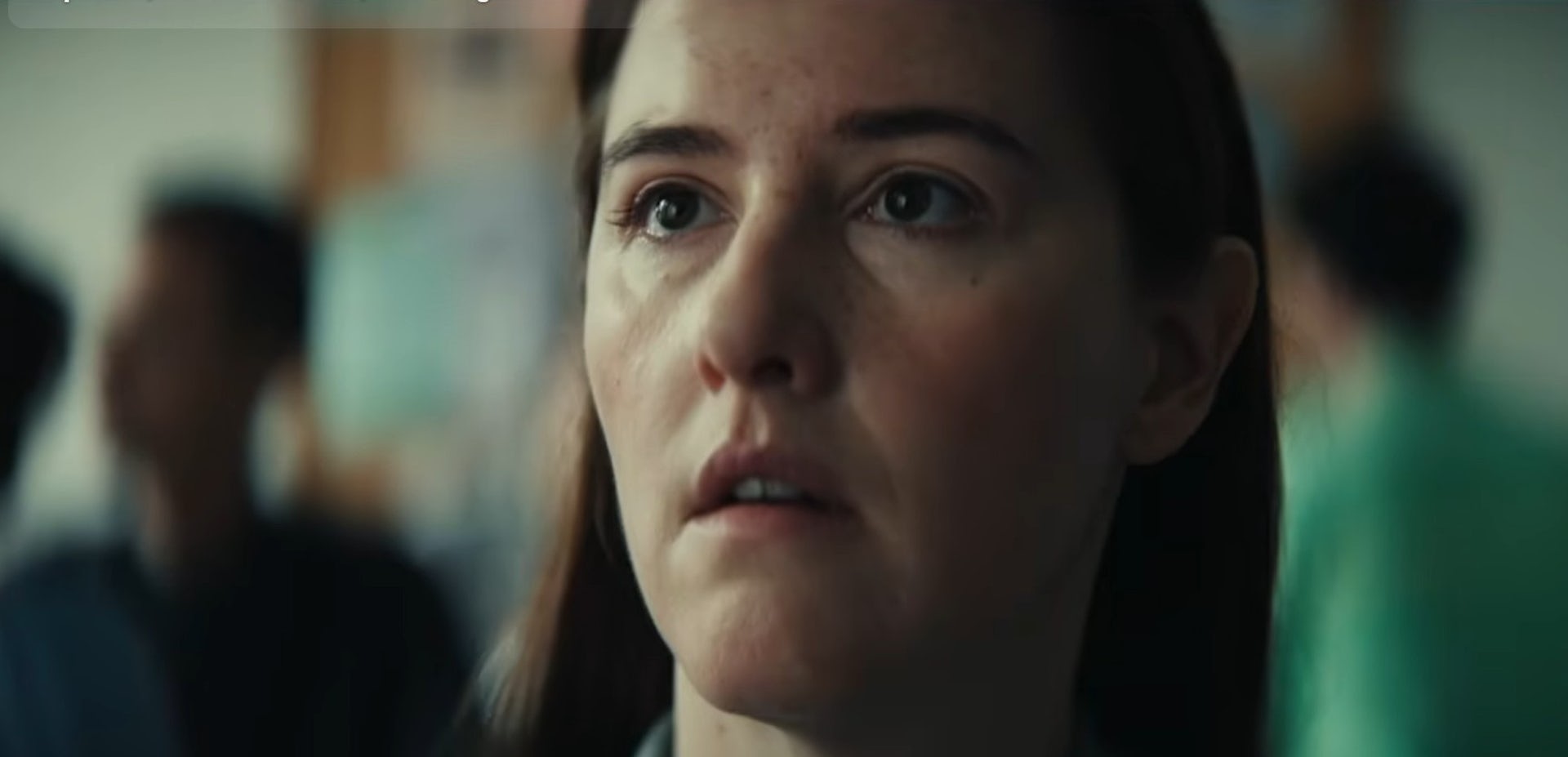 A woman's face is filled with emotion.