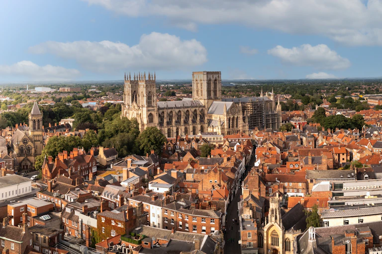 aerial shot of York city centre, old buildings, green parklands around edge