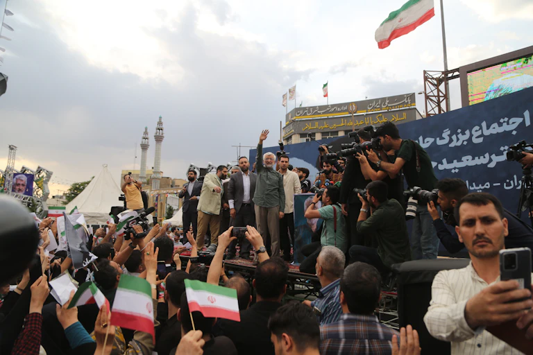 Saeed Jalini greets a crowd in Tehran during an election campaign event.