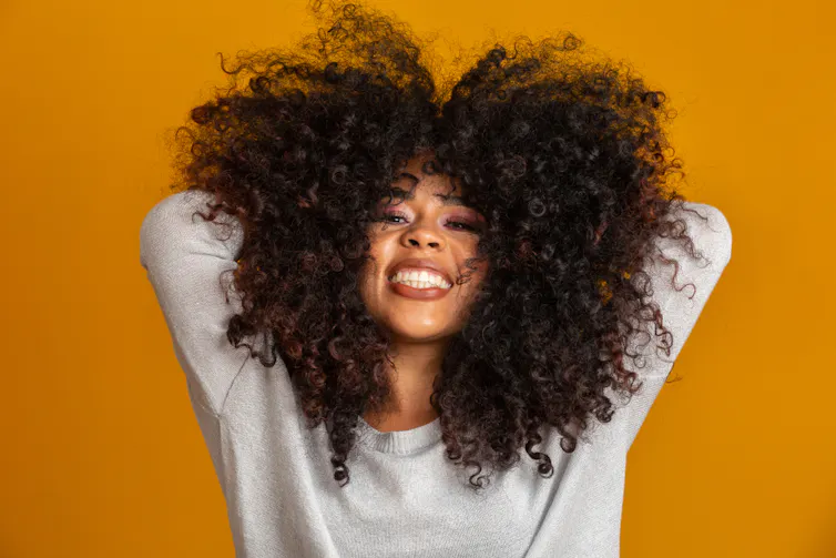Woman enjoying her hair.