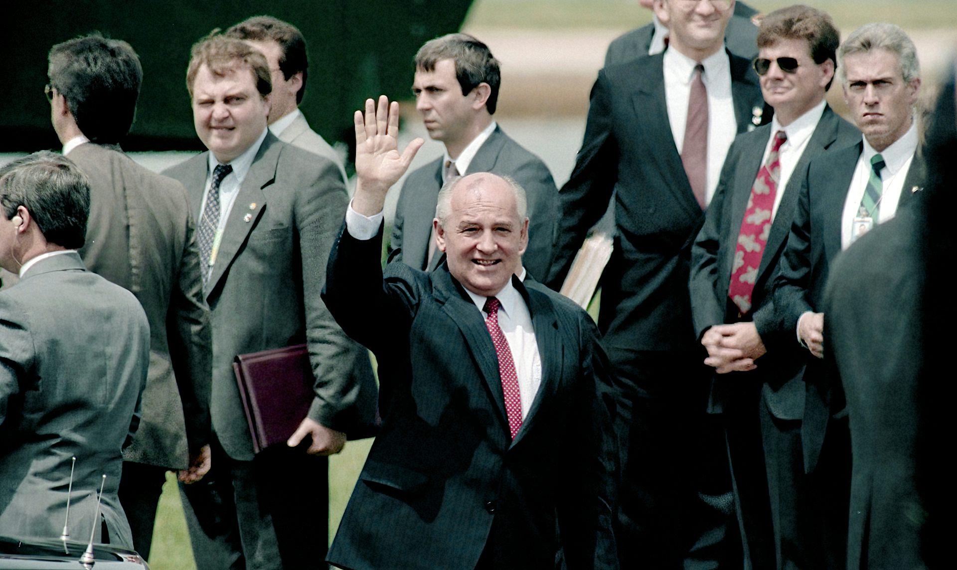 Mikhail Gorbachev waves as he prepares to leave a state visit in Washington.