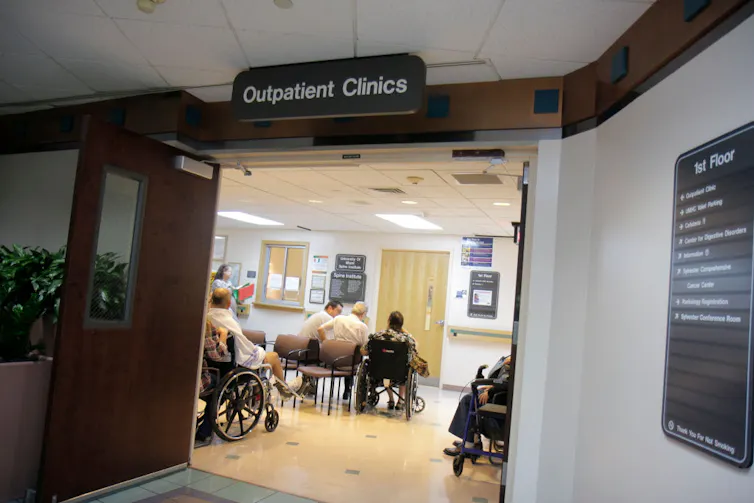 A sign reads 'outpatient clinic' above a doorway.