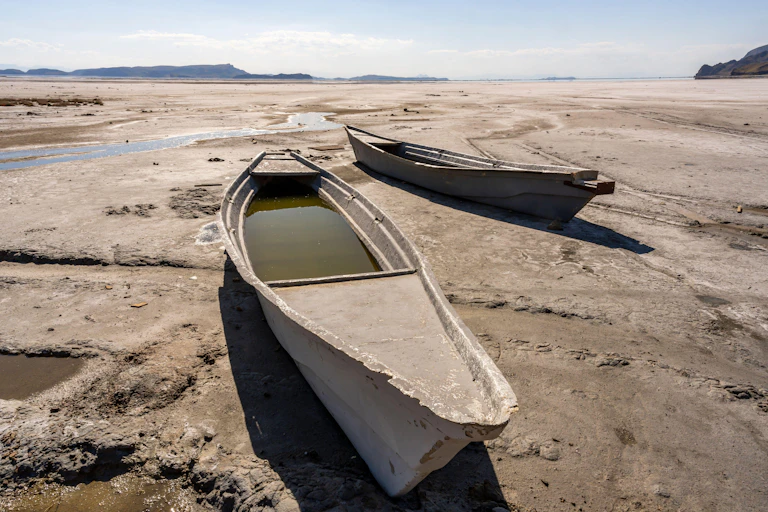 Two boats in a dried up lake in Iran