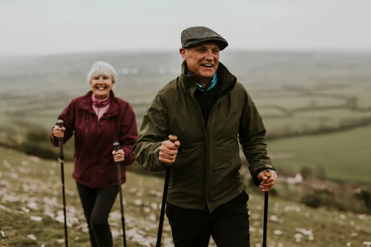 Two older people out walking in the countryside