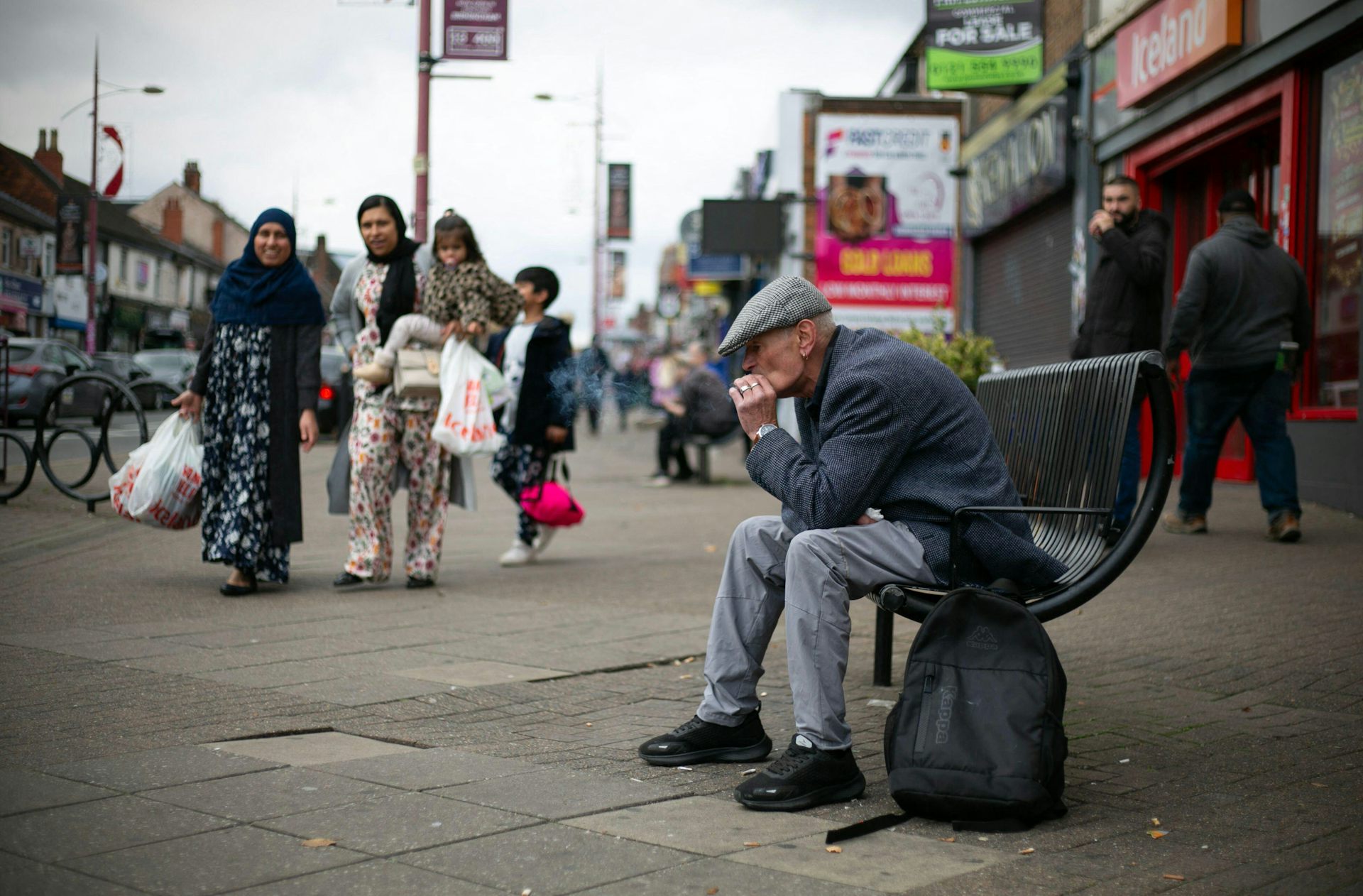 Old man on a bench in Birmingham