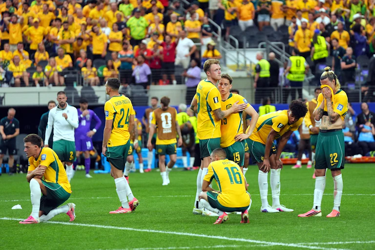 Players of Australia react after losing the penalty shoot