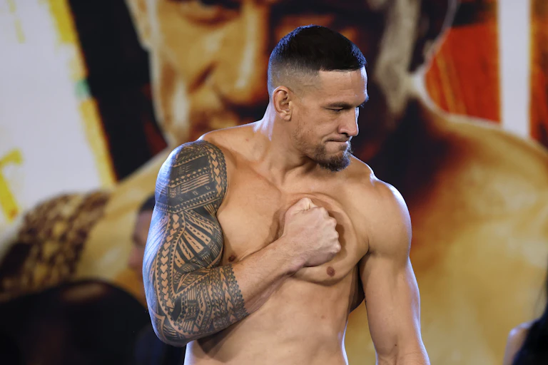 Former All Black Sonny Bill Williams holding a fist against his heart