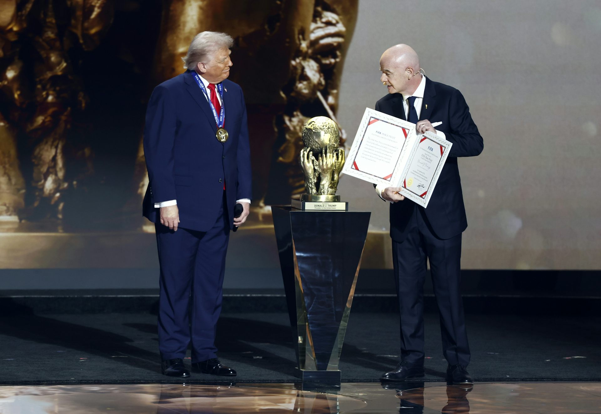 Fifa president, Gianni Infantino, presents the US president, Donald Trump with the 'Fifa Peace Prize'.