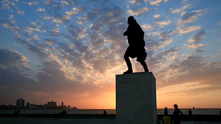 The silhouette of a statue at dusk.