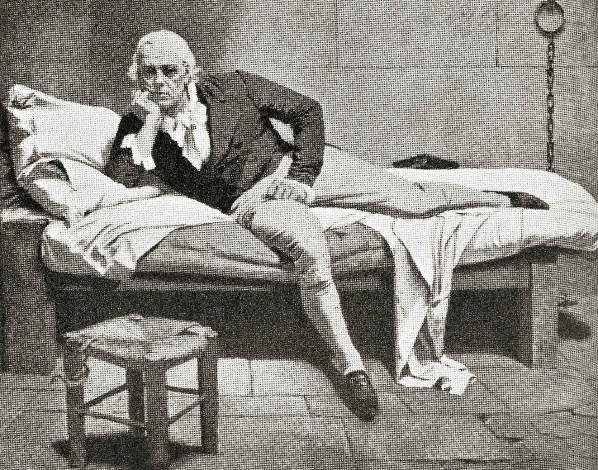 An old black and white drawing of a man on a bed.