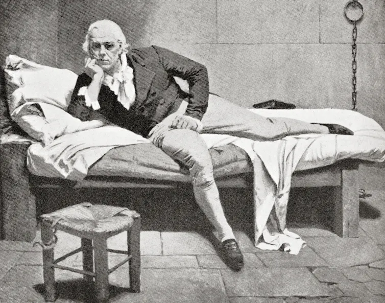 An old black and white drawing of a man on a bed.