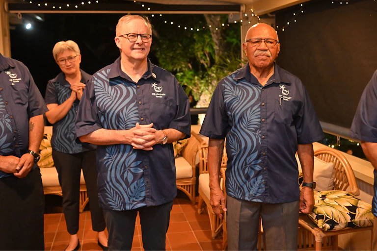 Anthony Albanese and Sitiveni Rabuka wearing matching shirts