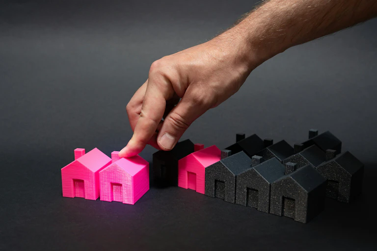 black and pink house figurines made of plastic