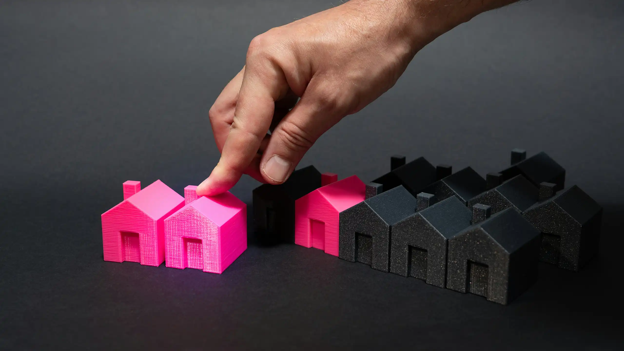 black and pink house figurines made of plastic