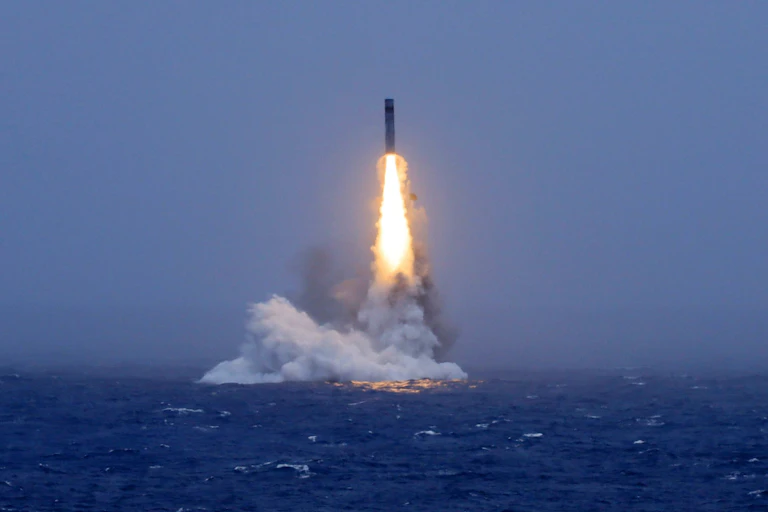 A missile launching from the ocean