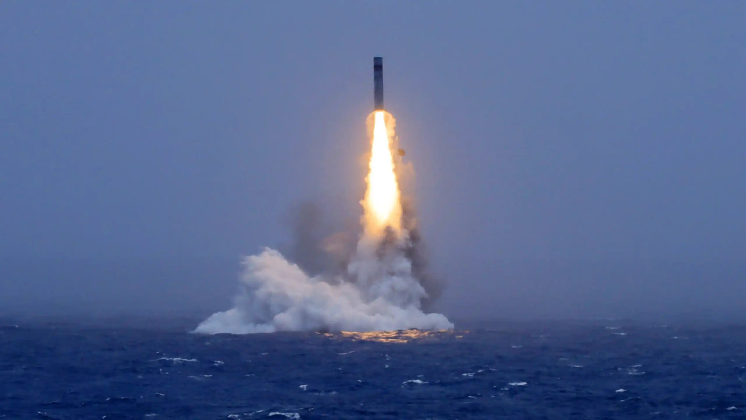 A missile launching from the ocean