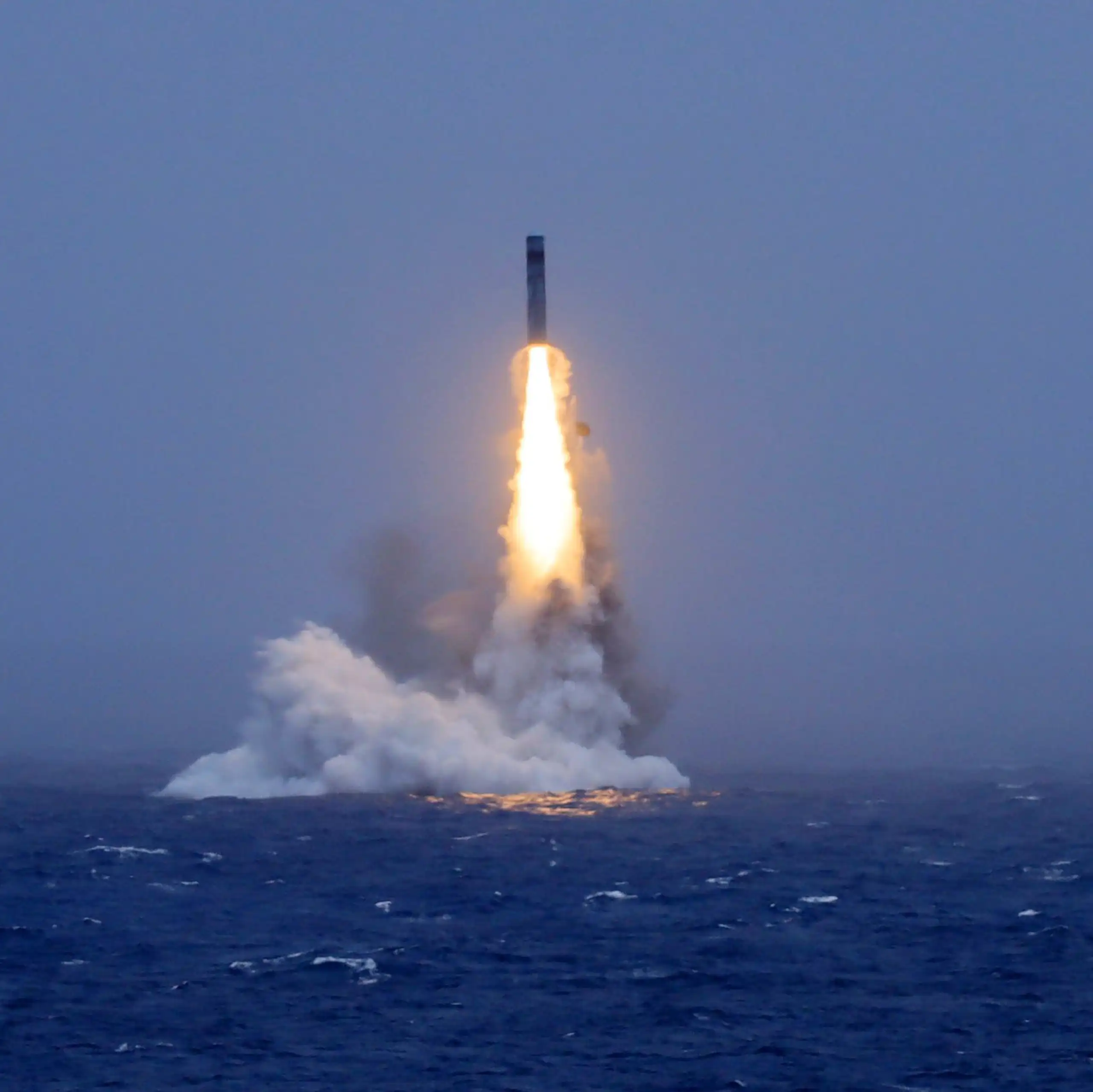 A missile launching from the ocean