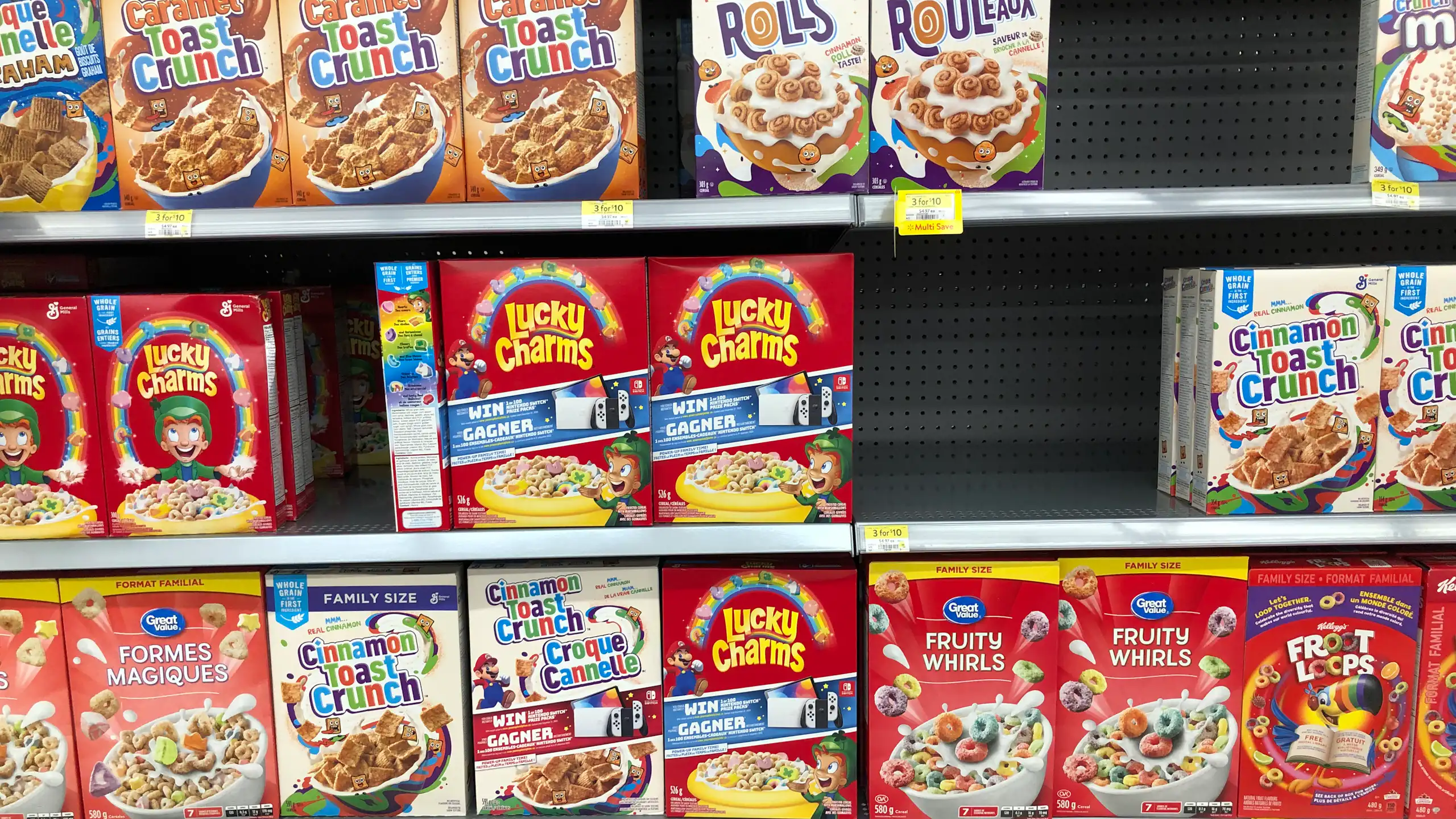 Different brands of breakfast cereal on a grocery store shelf