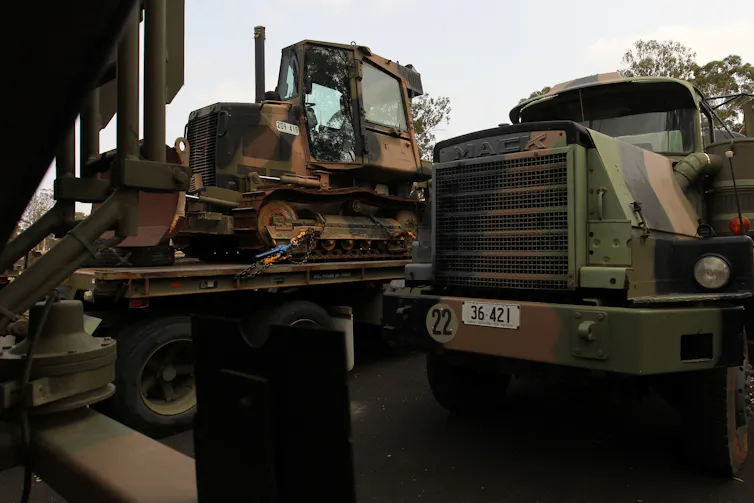a defence force bulldozer and truck